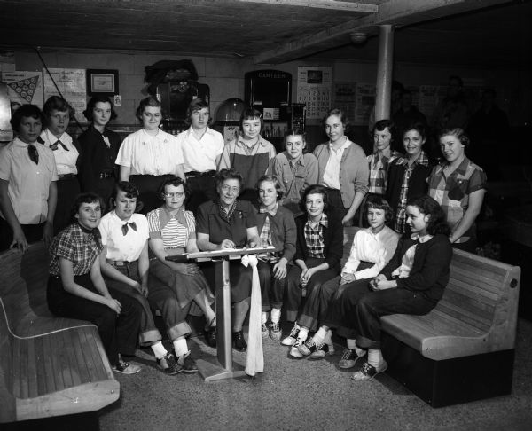 Group portrait of a women's bowling group, St. Cecilia Junior Forester's, at Lark Lanes Bowling Alley, 2554 University Avenue.