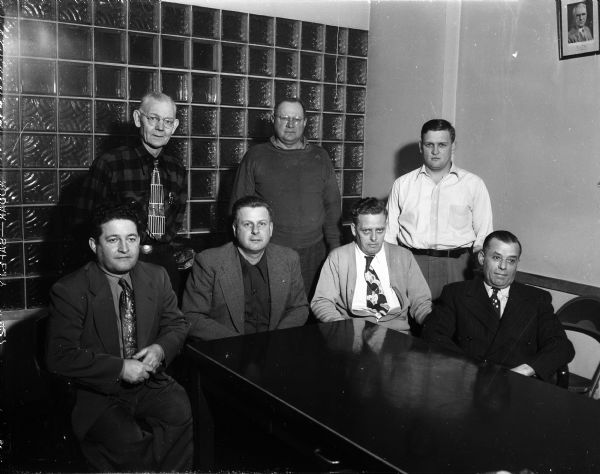 Group portrait of the recently elected officers of the Madison Truck Driver Local 442 Union. Front row, left to right: Leslie White, business agent and recording secretary; Gordon Bergensk, president; Fred Siewert, secretary-treasurer; and Joe Zoch, trustee. Back row: Bert Lampman and Carl Pauls, both trustees; and Herman R. Kerl, vice-president.
