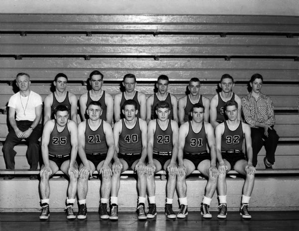 The Prairie du Sac High School basketball team plays Lodi on Friday night. If the Prairie du Sac team were to win the game, it would share the Tri-County League championship title with Spring Green. Members of the squad (from left) are: (front row) Phil Cole, Jim Buchanan, Duane Solell, Dave Schroeder, John Bochmer and Ivan Guetzkow and: (back row) Coach John Cole, Curt Mueller, Ronald Taylor, Dave Cole, Bob Schwarz, and Manager John Gruber.