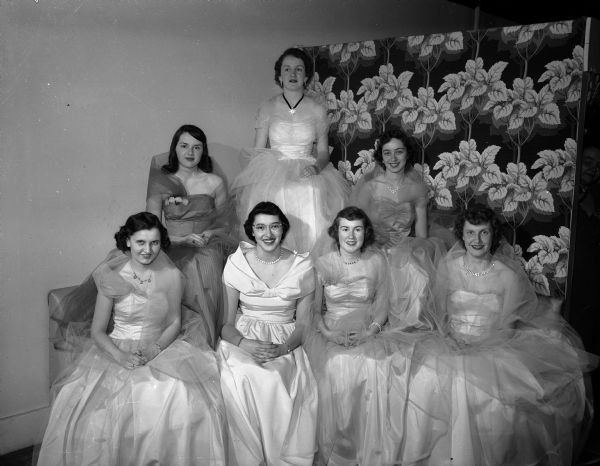 Anne Boberschmidt reigned as queen of the "Snow Swirl" winter formal dance sponsored by the sophomore class at Edgewood College of the Sacred Heart in the Edgewood Auditorium. Pictured are Queen Anne Boberschmidt, center of the second row, and her court. Pictured in the front row are Margaret Lynch, Francis McGrath, Rita McGarty, and Margaret Fahey and in the second row are Nancy Feeley and Mary Downey. Chaperones were Elizabeth and Roy Boberschmidt, Mildred and Eugene Downey and Mr. and Mrs. James Feeley. The orchestra of Dan Garson supplied the music.