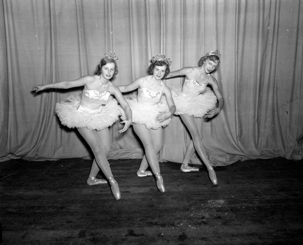 Three ballet dancers from Madison West High School perform at a benefit show sponsored by the school's Parent Teacher Association. The dancers are, left to right: Sylvia Hasler, Marjory Martin, and Claudia Schroeder.