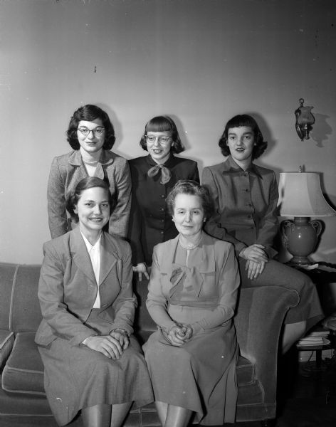 Officers of the new honorary society for the University of Wisconsin residence halls gather for a portrait. Seated are: Ruth Merow of Sparta, president, and Mrs. Julia Hill, faculty advisor. Standing, left to right, are: Alice Lapidus of Kenosha, vice-president; Barbara Hamilton of Manitowoc, treasurer; and Janet Onernik of Madison, secretary.