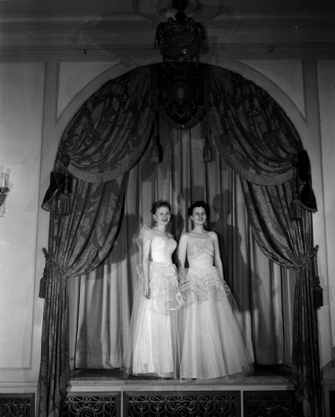 Mrs. John (Mary) Rawski (left) of 1219 Lee Court and Mrs. Joseph J. (Harriett) Coyne wear formal gowns. They were two of the models for the annual Jaycettes style show. It was held as part of the Big Top production, sponsored by the Junior Chamber of Commerce Auxiliary (Jaycettes).