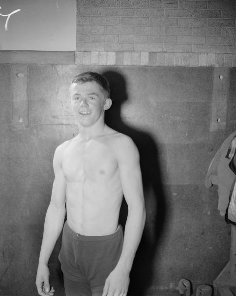 Portrait of Dick Hammes, 112 lbs, Madison West High School wrestling champion.  Portraits of nine other individual Big 8 Conference wrestling champions are shown with an article in the <i>Wisconsin State Journal</i> March 9, 1952.