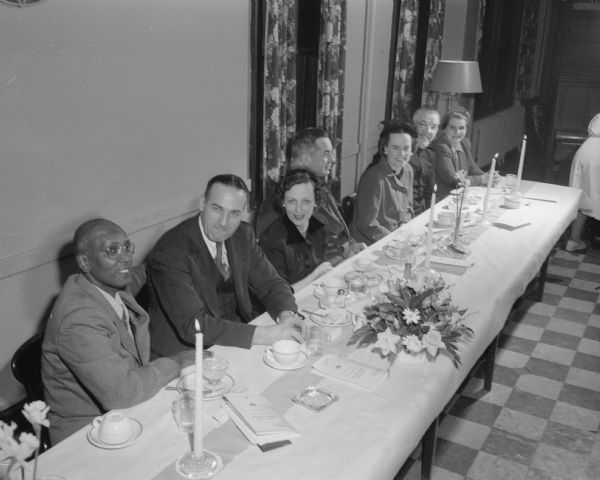 Speakers table at the annual dinner of the Madison YMCA. Left to right: Missionary Appadural Aaron, principal speaker; Walter Engelke, dinner chairman; Jean Alexander; Waterman Baldwin, Community Chest representative; Maureen Baldwin; Major Alex Stenouse, Salvation Army; and Margaret Cockrell. Aaron has served as a YMCA Secretary in India and Scotland for 28 years.