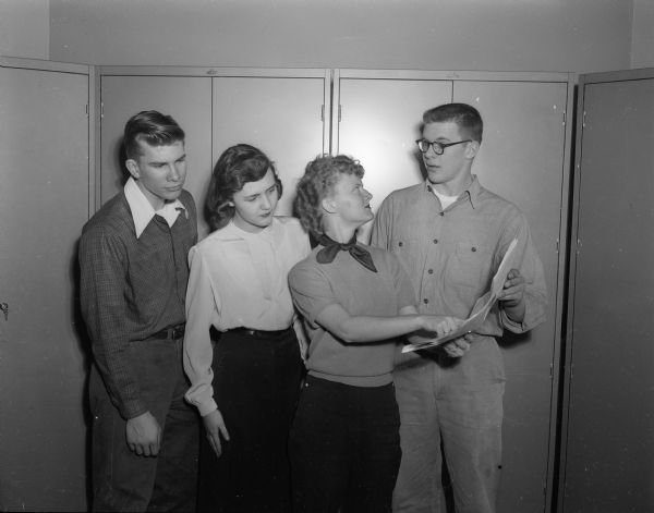 Left to right: Phil Kohl, Barbara Hull, Darlene Spaeni and Frank Hanson rehearing for the East High school operetta, "Tune In".
