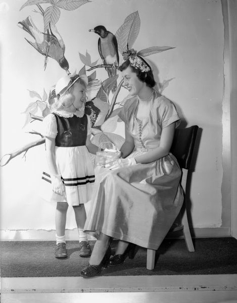 Models Patrica Quisling and Marcia Pilon are shown wearing spring fashions from Manchesters Department Store.