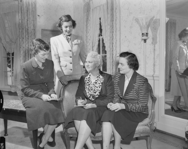 Planning committee for a tea for alumnae and students of MacMurray College, Jacksonville, Illinois. Left to right: Marilyn Meissner; Mrs. Erskine Morse;, Mary Rennebohm, wife of former Governor Oscar Rennebohm; and Mrs. W.F. O'Rourke, chairman of the event.