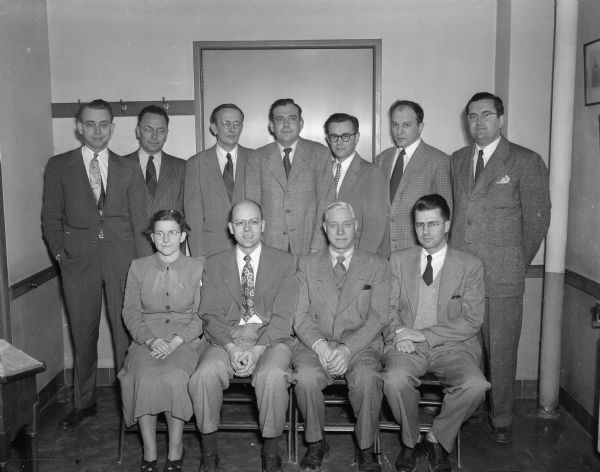 University of Wisconsin cancer research scientists who received grants from the Wisconsin division of the American Cancer Society are: Seated (left to right)are Dr. Elizabeth C. Miller, Dr. R.K. Boutwell, Dr. C. Leonard Huskins and Dr. G. A. LePage.  Standing (left to right)are Dr. James A. Miller, Dr. C. A. Baumann, Dr. M.J. Johnson, Dr. Henry R. Mahler, Robert E. Parks, Jr., Dr. Henry A. Lardy and A. C. Hildebrandt.
(Two other scientists, Dr. Folke Skoog and Dr. A.J. Riker, were unable to be present when the grants were made.)