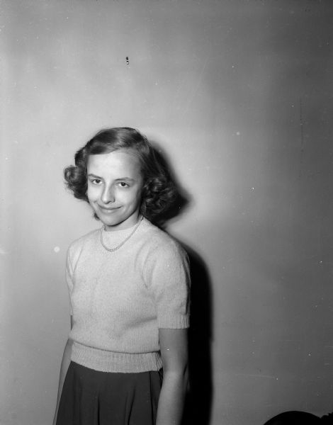 Spelling champions from twenty-three Madison public and parochial schools will take part in the city spelling finals of the <i>Wisconsin State Journal</i> 1952 Badger Spelling Bee in Scanlan Hall of the Vocational School. The winner will represent Madison in the fourth annual Wisconsin finals of the Badger Bee. Pictured is Carol Moir who represents Lowell school where she is a sixth grader.