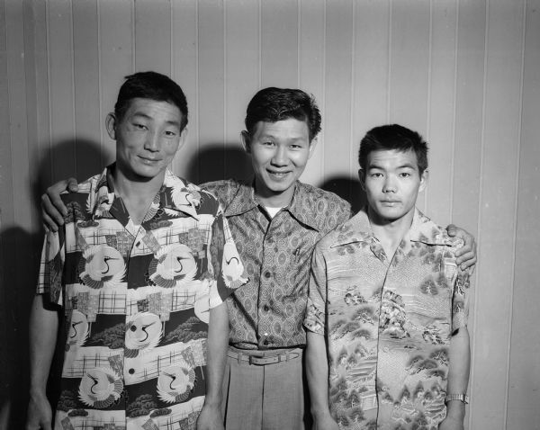 The group of fighters who came the farthest to compete in the 15th annual National Collegiate Athletic Association (NCAA) boxing tournament being held in the University of Wisconsin-Madison Field House were Francis Shon, left; Coach Herbert Minn; and Roy Kuboyama from the University of Hawaii.