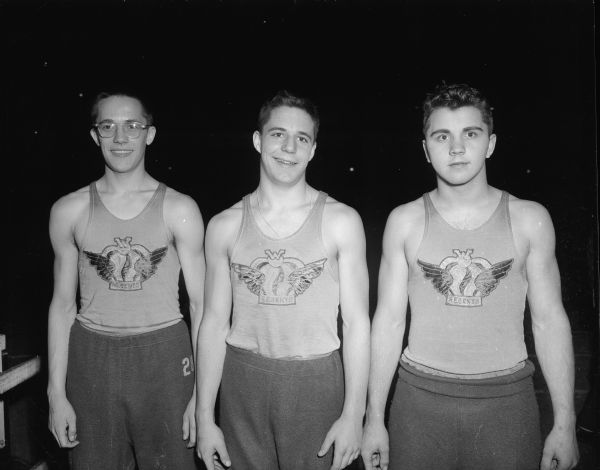 Shown left to right are Tom Consigny, Woody Sorensen and Don Adams of Madison West, who tied Beloit for first place in the 180-yard shuttle hurdle relay race.