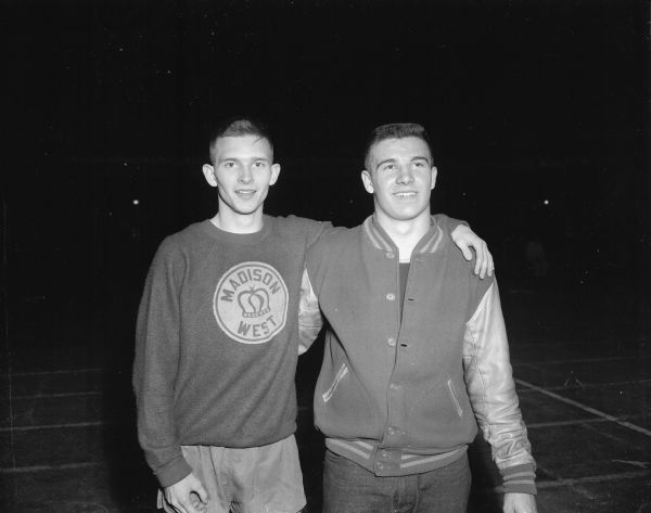 Portrait of Tom Mack (left) and Tom Schulz, both of Madison West, who won and set event records in the broad jump and shot put, respectively.
