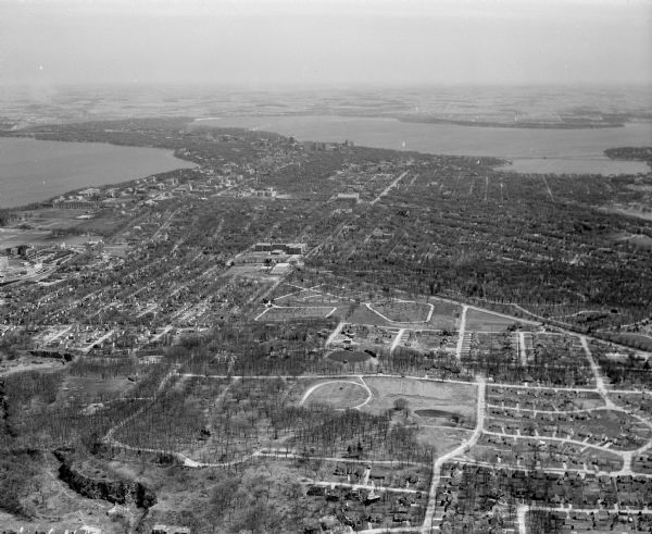 Aerial view of Madison taken from near the site of the WIBA radio tower, looking east toward the isthmus. Other images in this set look to the northwest, southeast, south, and northeast. The photographs were taken for Badger Broadcasting Company, the licensee for WIBA Radio and Television.
