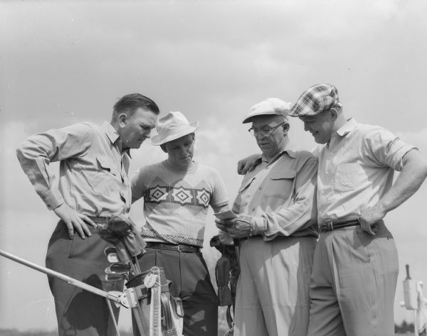 A golf foursome at Nakoma golf course are, left to right, A.F. Ahearn, Byron Wechtern, Ken Johnson, Sr. and Ken Johnson, Jr.
