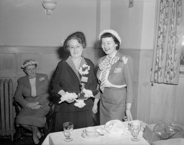Hazel Murphy Sullivan (left), editor of the <i>Sun Prairie Star-Countryman</i> and <I>Wisconsin State Journal</I> correspondent, holds the Writer's cup she was awarded by Theta Sigma Phi alumnae at their annual Ladies of the Press breakfast for her outstanding achievement in newspaper writing. Standing with her is Mrs. Joseph (Felice L.) Goodman, chapter president, who made the award.