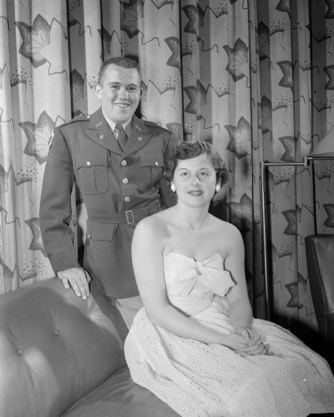 Roy Burks, member of the advanced ROTC transportation corps, and Norma Cross, King and Queen of the University of Wisconsin-Madison's 36th Military Ball.