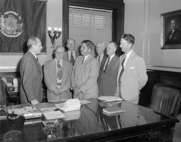 Group of seven men including the governor in Governor Kohler's Office. One of the men is Holman?