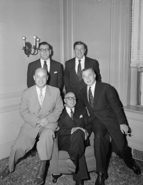 Leo L. Lunenschloss (front row, center), vice-president of the Ohio Chemical and Surgical Equipment Co. is shown at his retirement dinner. On the left is G.J. Dekker, president of Ohio Chemical. On the right is John A. Hill, president of the Air Reduction Co. of New York City, which is the parent company of Ohio Chemical and Surgical Equipment Co. In the back row are J.H. Humberstone (left), and D.W. Gibson, both ofwhom are vice-presidents of Air Reduction Co.