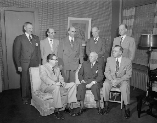 The honored guests who helped the Madison Lions Club observe its 30th anniversary at a banquet at the Park Hotel. Seated, left to right, are: G.I. Wallace, international counsellor for the Madison club; George A. Doll, Ft. Morgan, Colorado, the main speaker; and Henry Schmid, New Glarus, district governor. Standing, left to right, are: E.K. Steul, past president of the Madison club; Len C. Porter, Cuba City, a candidate for district governor; S.A. Mansour, Merrill, special representative to Lions International; Ray Galipeau, Merrill, candidate for international director; and Louis O. Huseboe, Madison club president.