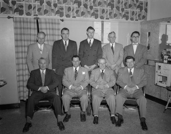 Members of the Wisconsin Barbers Local #153 and Barbers Guild #23 joint committee to plan the annual convention of the Wisconsin Barber and Beauty Culture Association to be held in Madison. Seated, left to right, are: Elroy J. Morhoff, Middleton; John A. Billie, Manitowoc, association president; Emil Koch, Milwaukee, association vice-president; and Sam J. Fedele, Madison. Standing, left to right, are: Theodore Hansen, Madison; George Benseman, Madison; Donald Hartin, Oregon; Glen Wheeler, Madison; and Richard W. Klinger, Madison.