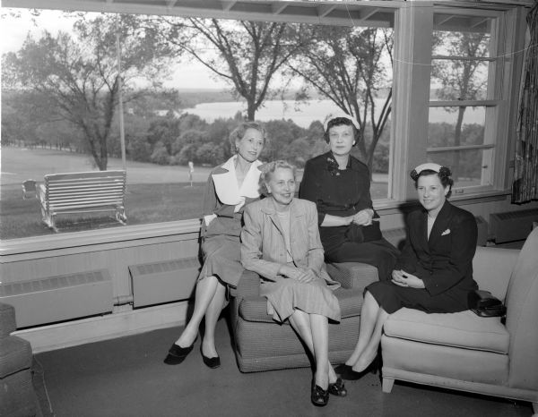 Relaxing in the Blackhawk Country Club lounge and discussing the golf program, are left to right: Mrs. Harry Stiero, Nettie Peterson, Estella Meek and Elizabeth Spencer.
