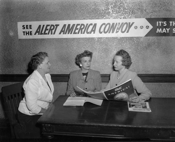 Three volunteer supervisors who will be on hand to help explain the Alert America Convoy exhibit to visitors when it is at the University of Wisconsin-Madison Field House. Left to right are: Mrs. A.R. (Florence) Thiede of the Business and Professional Women's Club, Mrs. Ira Langlois of Amaranth, and Mrs. Mack (Mildred) Mitchell of Zor auxiliary.