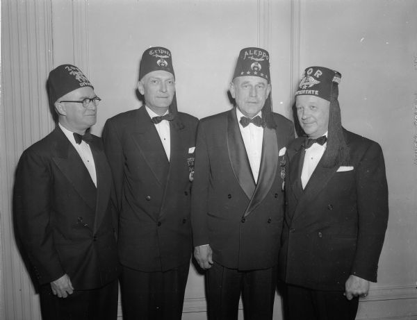 Four Zor Shriners at the Madison temple.  Left to right are: Arthur F. Trebilcock, Madison; Thomas W. Melham, Milwaukee; Imperial Potentate Robert G. Wilson Jr., Boston, MA; and Arthur G. Raatz, La Crosse.