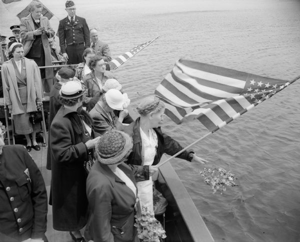 Members of the Women's Relief Corps scattered flowers on the waters of Lake Mendota in honor of Navy and Air Force dead as part of Memorial Day services in Madison.