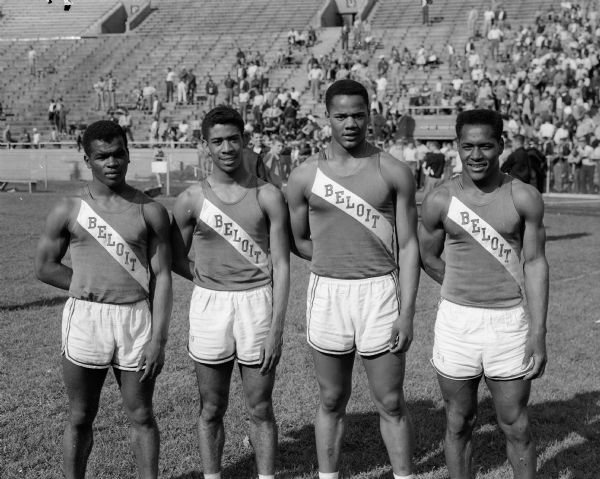 Beloit High School's 880-yard relay team raced to its 19th straight victory in that event and its second consecutive relay triumph in the state meet.  The winning quartet pictured (left to right) are George Foster, LaVerne Bradford, Frank Clarke, and Tarzan Honor.