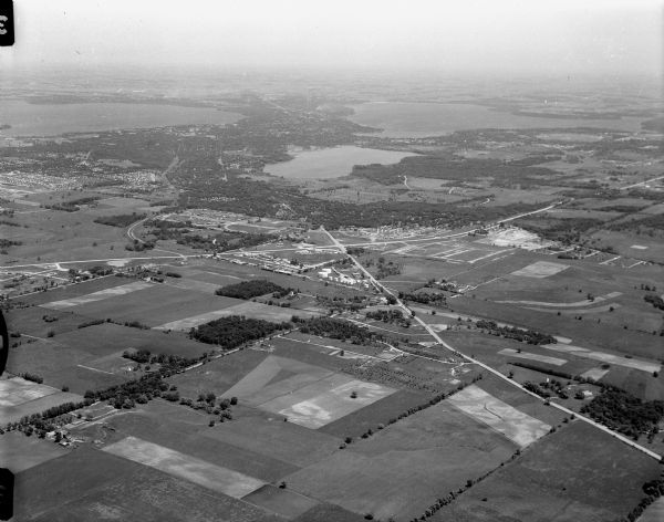 Aerial photos probably of Madison, looking north east from intersection of Nakoma Road (Hwy. 18-151) and West Beltline Highway (Hwy. 12-18) toward Isthmus, Lake Mendota, Lake Wingra and Lake Monona.  Photos taken for Bill Walker.