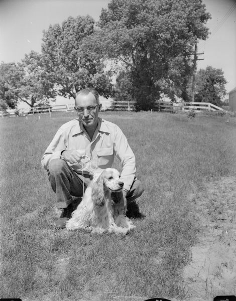 Harvey Warner with his Cocker Spaniel, "Sonny." The dog will be competing at the Badger Kennel Club dog show.