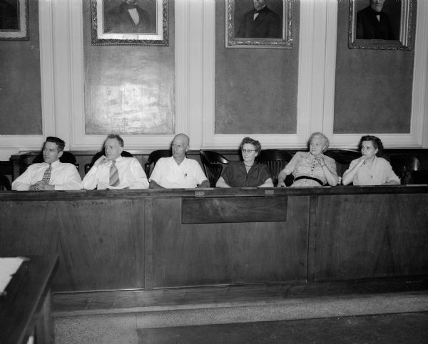 Six coroner's jurors as they listened to witnesses at the inquest of the traffic death of Alice Kinney. Jurors are, left to right: Burnie L. Sweet, Chester Gill, A. T. Esser, Bernice Hanson, Mrs. Jess Ayers and Gretchen Pfankuchen.