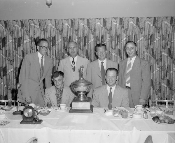 Planners of the Madison city golf meet banquet, back row, left to right: John Secord, Blackhawk Country Club; Walter Rhodes, Blackhawk; Lester Lee, Nakoma; and Frank Blau, tournament sponsor. Winning golfers, front row: Billy Milward, Nakoma, first place; and Walter Atwood, Blackhawk, second place.