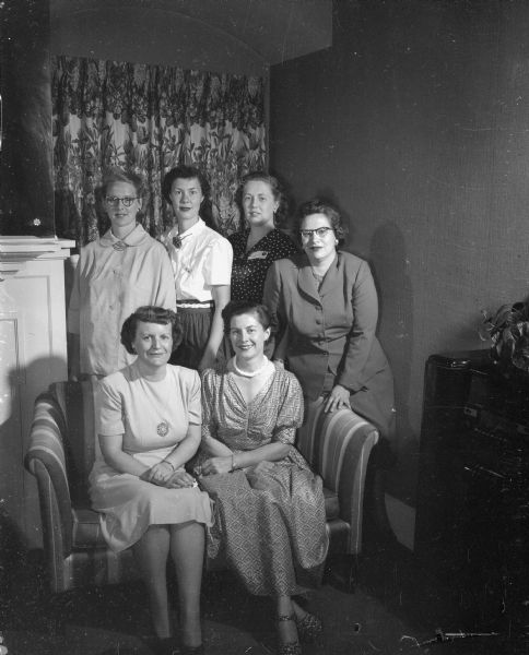 Group portrait of six women taken at 222 Lakelawn Place (Psi Upsilon Fraternity House ?)