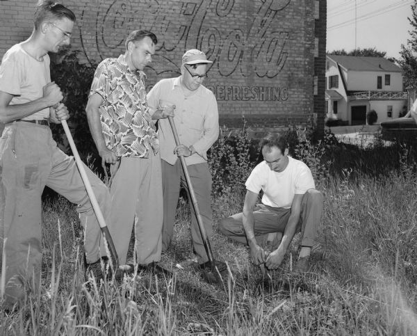 Four officials of the South Side Men's Club participate in groundbreaking for their new club house, Sunday, June 29, 1952. Shown left to right are: Tom Hartman, Dave O'Dea, Glen Mason, Warren D. Kowing.