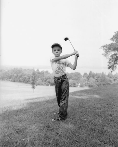One of the youngest to participate in the first junior day at Blackhawk Country Club was John Mack, shown practicing his swing.