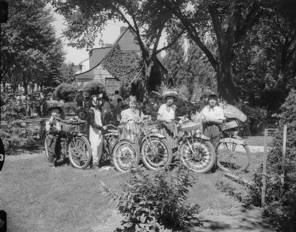 Children pose with bicycles decorated for the Fourth of July.