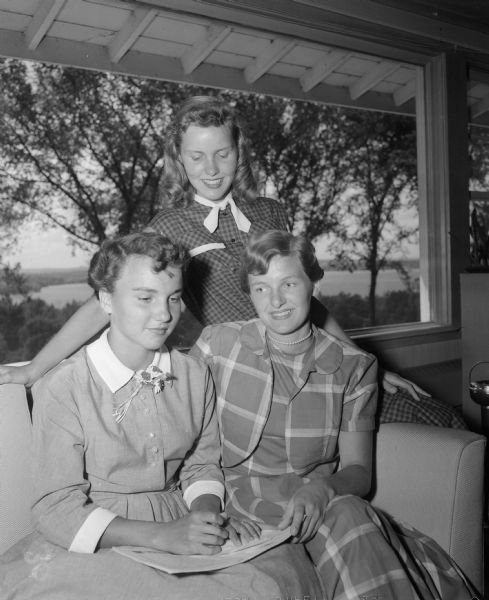 Three members of the Shorewood Hills Dance Committee. The young women are, left to right: Nancy Blume, Barbara Boesel, and Lee McGann.