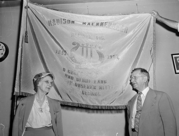 Caroline and Otto Niemann with the new Madison Maennerchor flag, a gift of the Niemanns to replace the previous flag lost in a 1940 fire.
