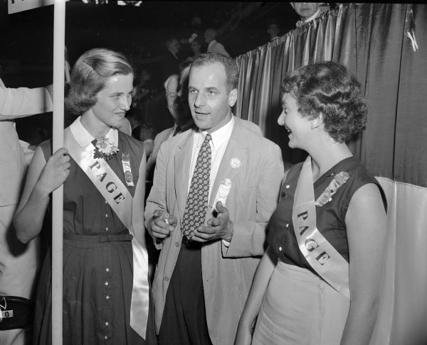 Senator Gaylord Nelson, Madison chairman of the Wisconsin delegation to the Democratic National Convention stands between two pages — Marilyn Mayer from Illinois and Nancy Raskin, Milwaukee, daughter of labor attorney Max Raskin.