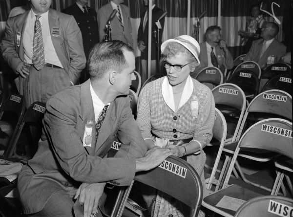 William Proxmire chats with fellow delegate Edna Bowen on the floor of the National Democratic Convention. Proxmire, then an assemblyman, was making his first race for Governor of Wisconsin. Proxmire would run for governor unsuccessfully three times before being elected to the U.S. Senate following the death of Joseph R. McCarthy in 1957.  Edna Bowen was a Democratic candidate for Congress.