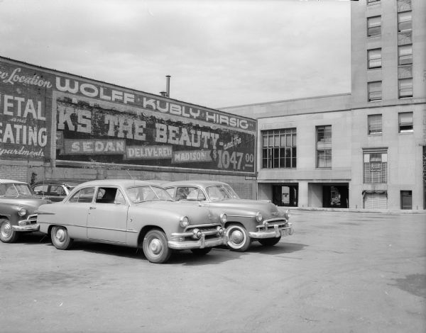 Buick advertising sign in the first block of North Fairchild Street, uncovered by workers who removed another billboard that had covered the old sign.