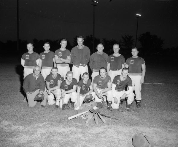 Group portrait of Frankie's Tavern softball team wearing their 1950 City-State Champions t-shirts.  Tavern owned by Frank Lombardo.