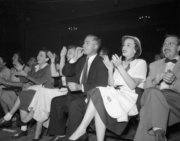 Live audience attending the 25-hour radio talkathon of Leonard F. Schmitt, Merrill attorney who is challenging U.S. Senator Joseph B. McCarthy for the Republican nomination in the primary. Seated in the front row, left to right, are: Irene Rumsdell, Mrs. Arron (Ruth) Bohrod, Mrs. Willard S. (Mary Ellen) Stafford, Mr. Stafford, and Mrs. Carl (Elizabeth) Runge, all of Madison.