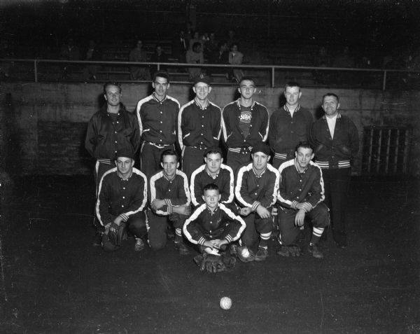 Outdoor group portrait of the Stadium Bar 1952 softball team, city major softball league champions.