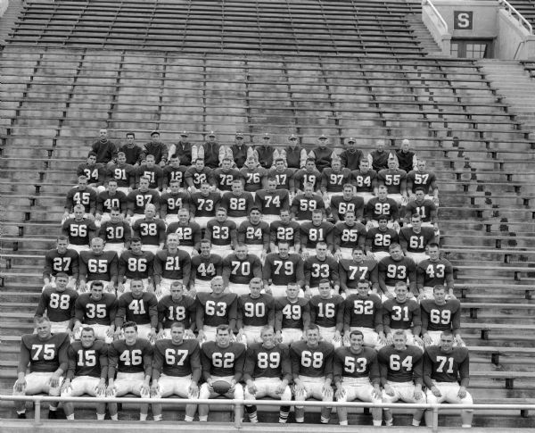 Outdoor group portrait of U.W. football squad.