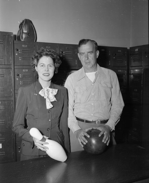 Portrait of Lillian Niebuhr, left, president of the Madison Woman's Bowling Association, and Frank Gottsacker, right, president of the Madison Bowling Association (men).