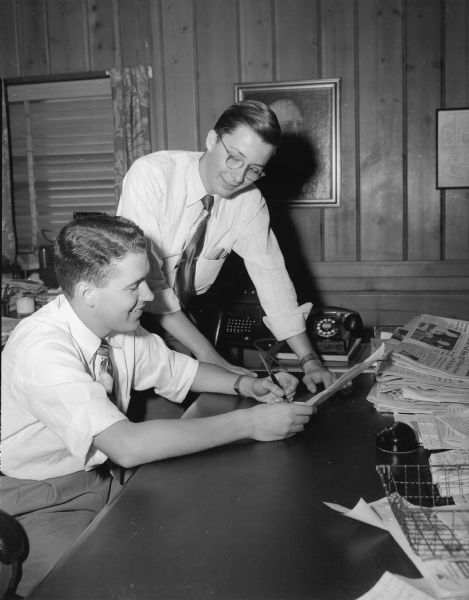Jake Harned, publisher, and John Dutton, editor, of the Shorewood Chronicle.  The publication of Shorewood Hills was suspended after seven years of continuous weekly publication.