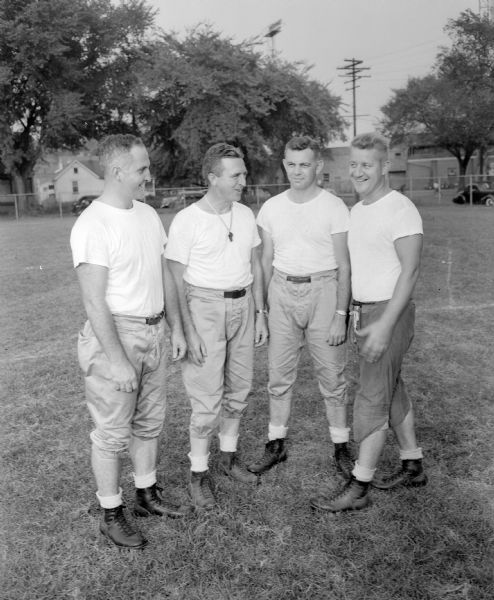 Madison Central High School football coaches, from left to right:  Harold Rooney, Harold Pollock, Robert Alwin, and Frank Lindl.